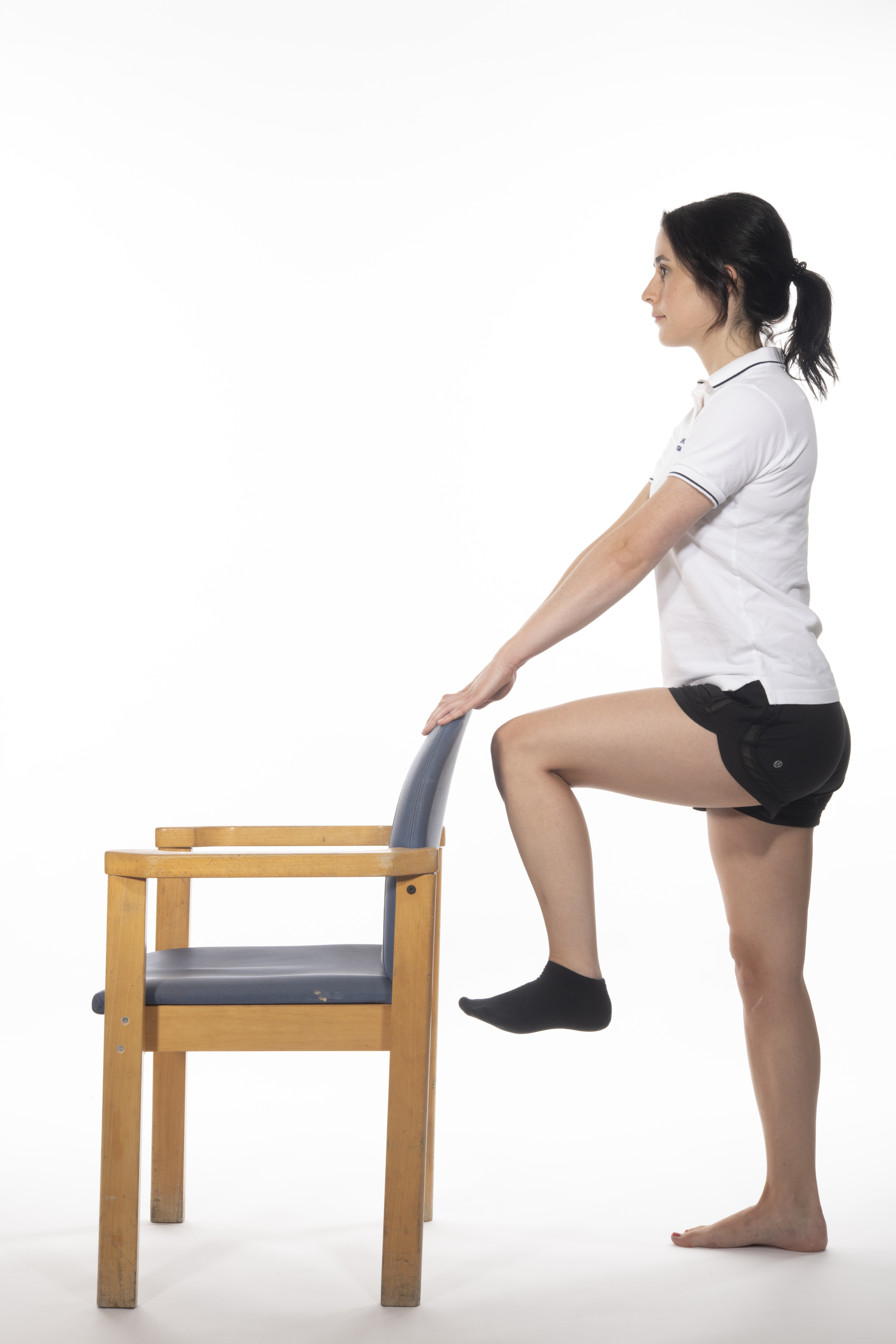 Hip flexion in standing exercise; lift your operated leg, bending your hip and knee up toward your chest