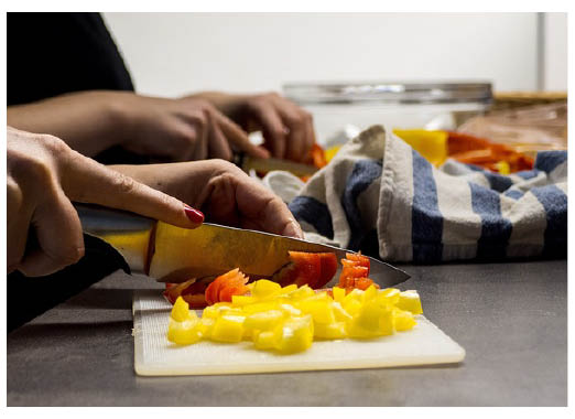 Photo of vegetables being chopped into small pieces