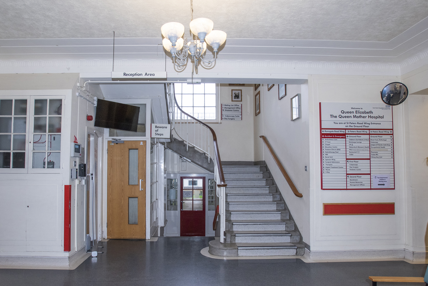 Photo of the stairs, just inside the St Peter's Road entrance doors, that go up to Day Surgery at QEQM