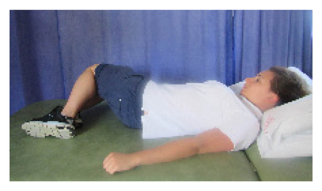 Slowly roll your knees from side to side keeping your upper trunk still