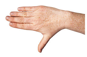 Keeping your hand flat, try to move your thumb away from the rest of your hand.