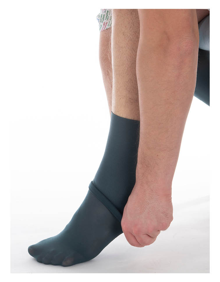 Step 4 - continue pulling the stocking up your calf, making sure you smooth out any creases or excess material as you go