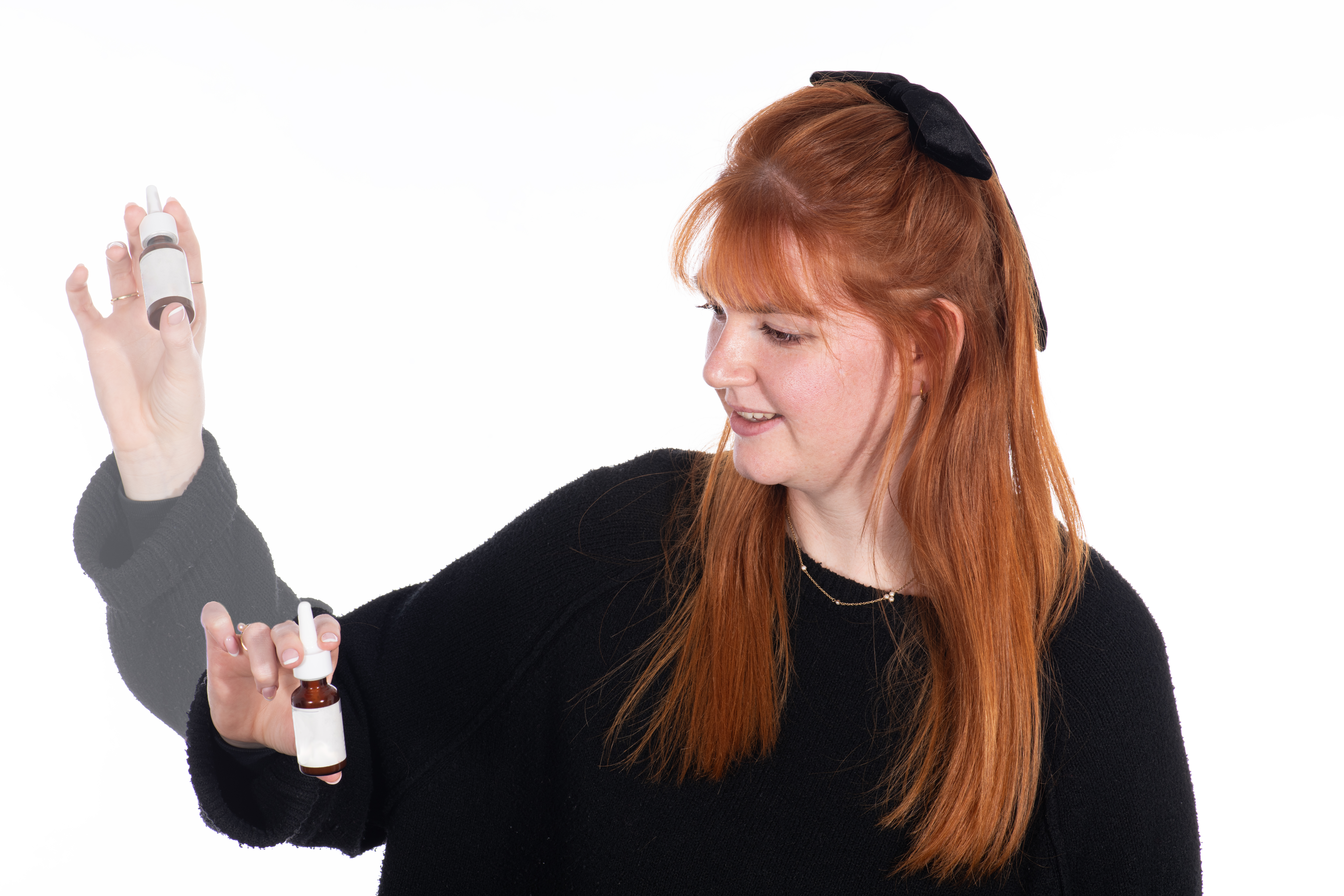Person shaking the nasal spray bottle