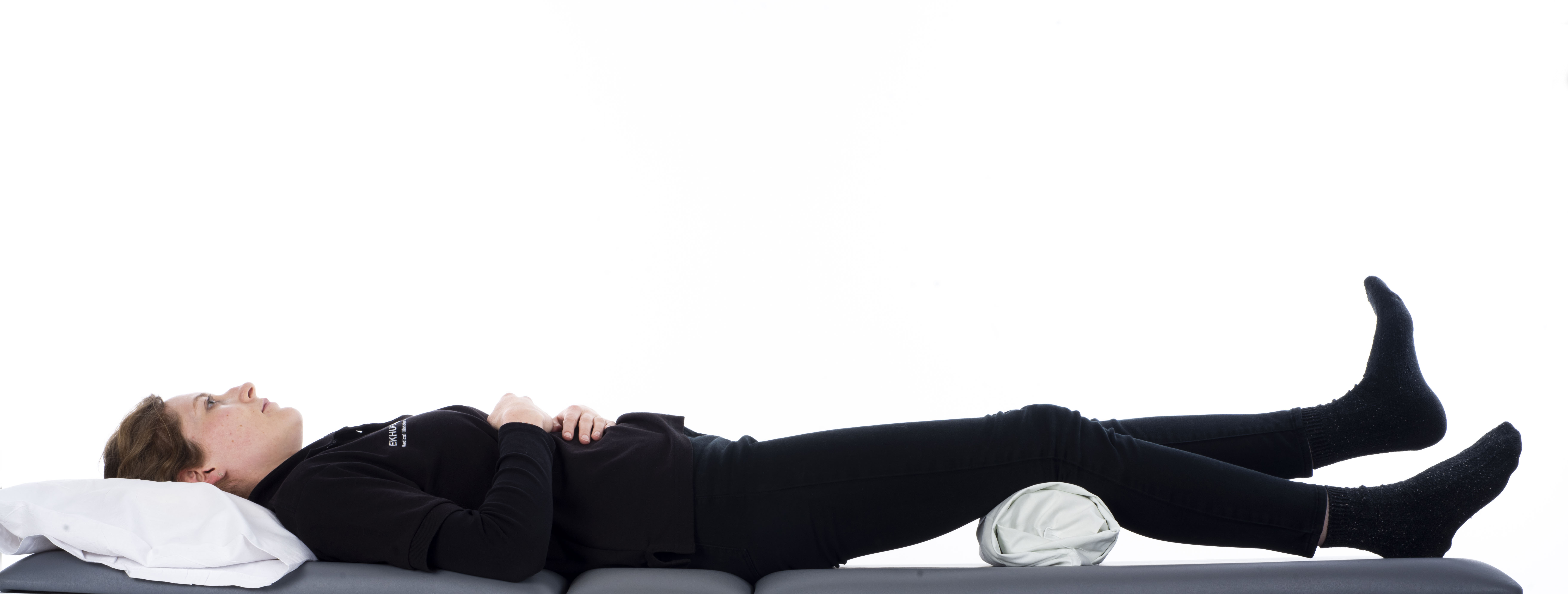 Heel lifts; with a rolled-up blanket under your knee, tense your thigh muscle and lift your heel off the bed