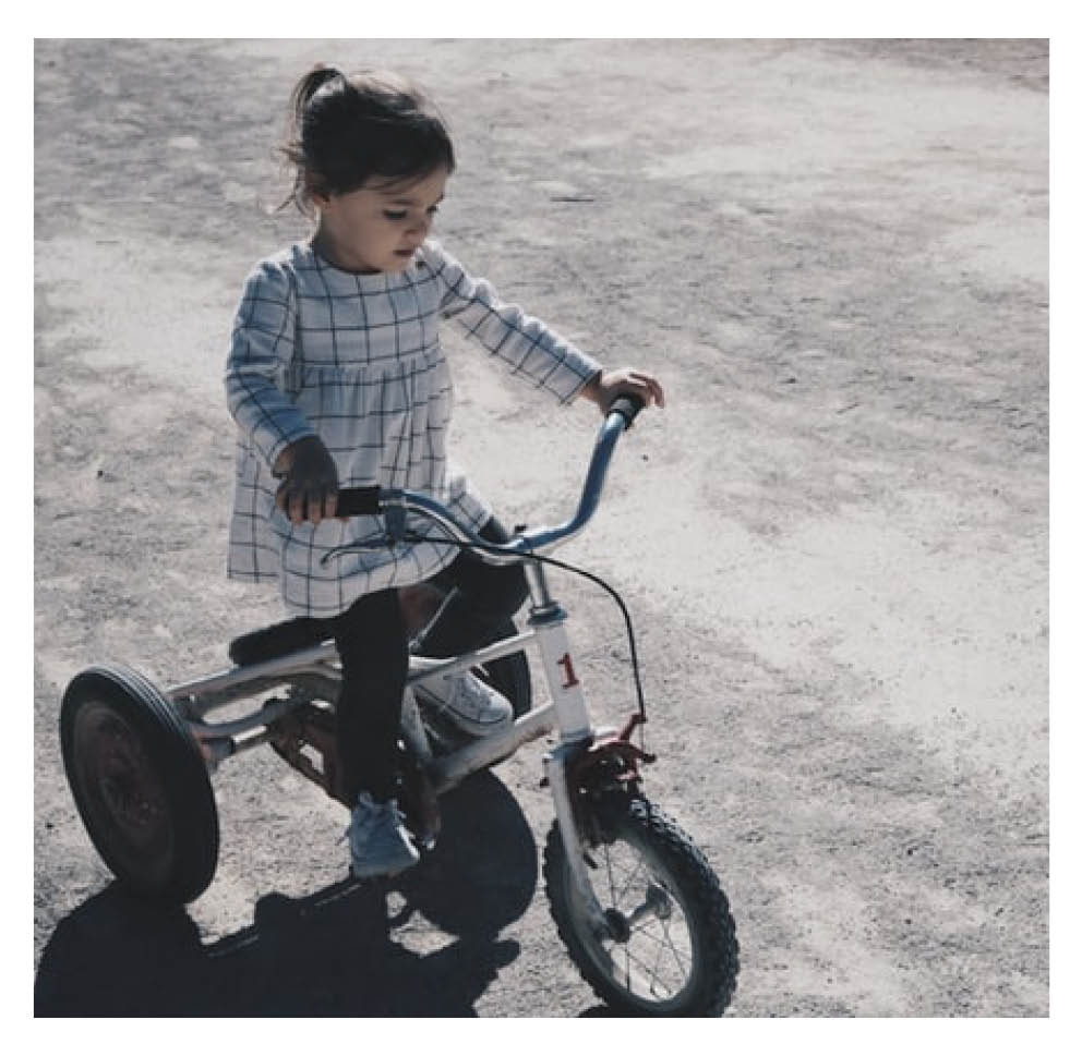 Child riding a tricycle